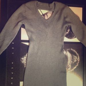 Form fitting grey sweater dress.  Cutout in back